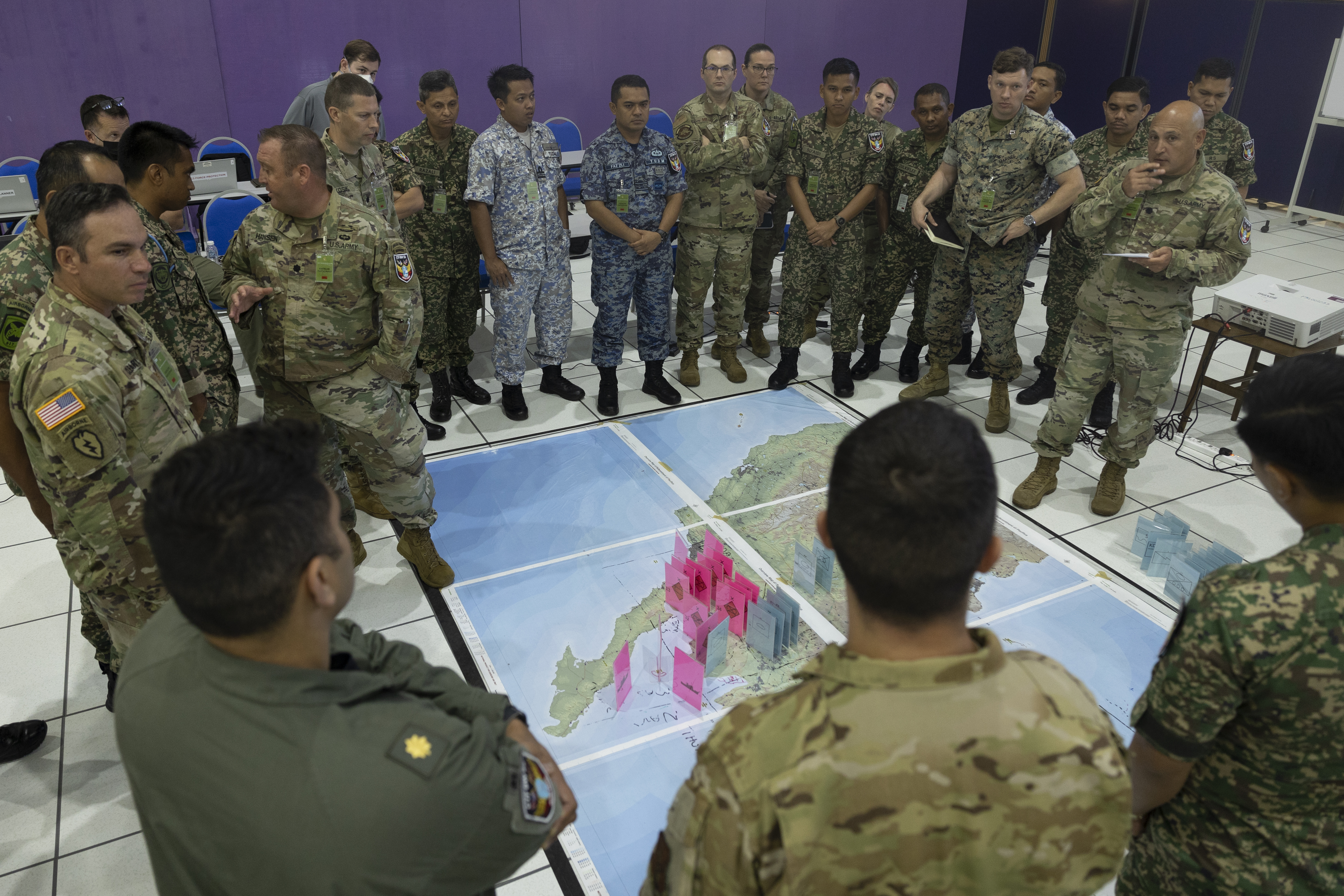 U.S. and Malaysian servicemembers discuss course-of-action concept during staff exercise for Bersama Warrior 23 at Joint Warfighting Centeron Malaysian Armed Forces Headquarters, Kuantan, Padang, Malaysia, June 12, 2023 (U.S. Marine Corps/Alexandria Blanche)